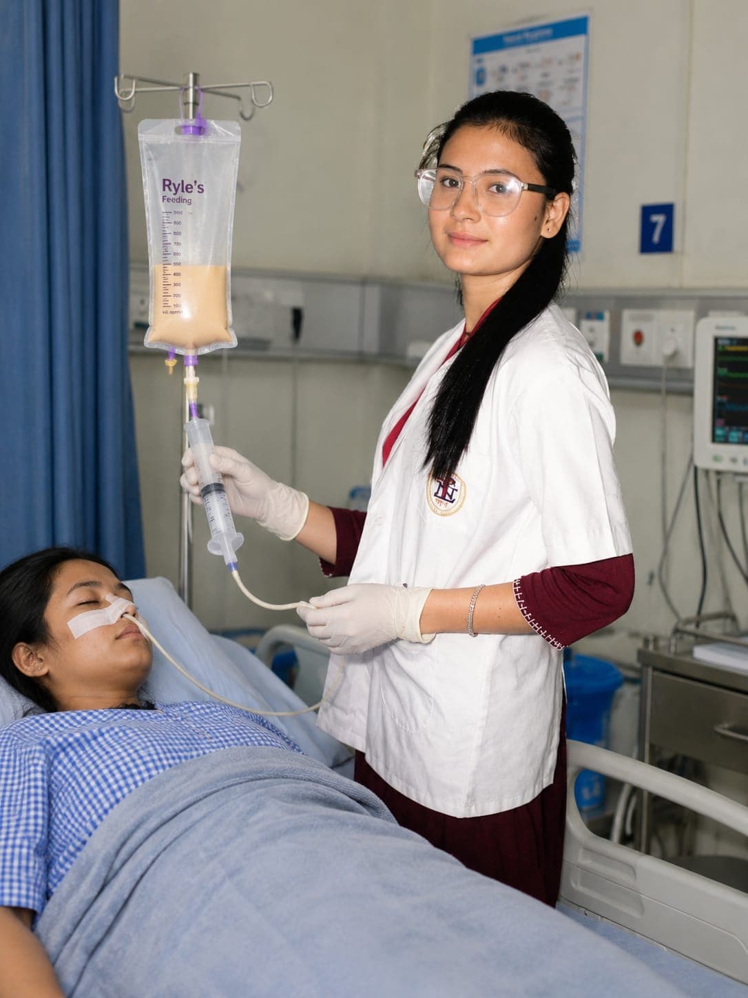 Nurse providing clinical patient care and feeding support
